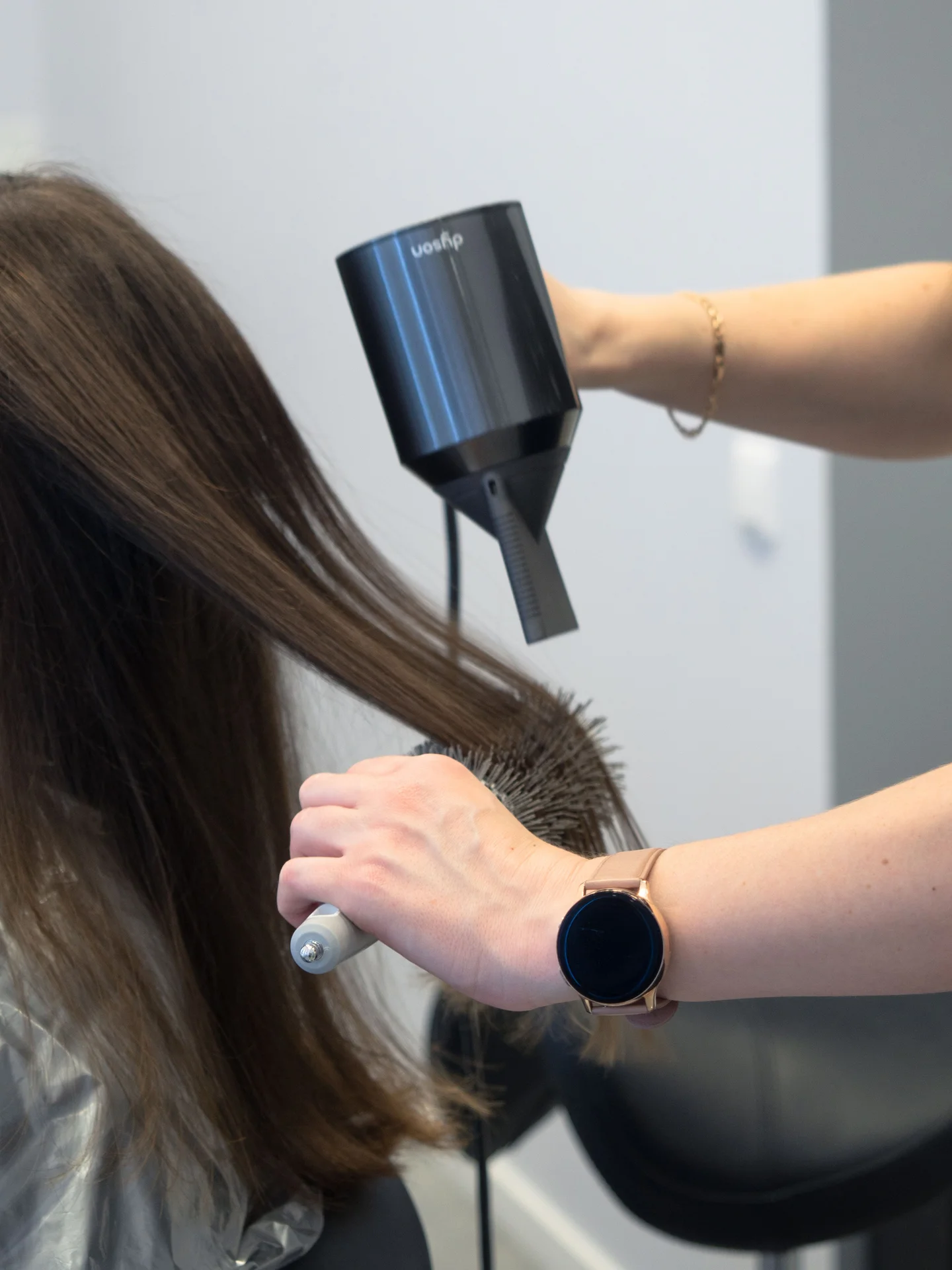 A blow wave in progress with a round brush